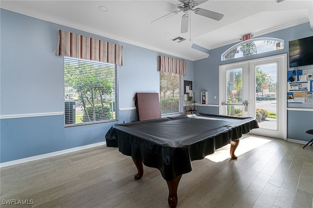 playroom featuring a wealth of natural light, french doors, pool table, ceiling fan, and light hardwood / wood-style flooring