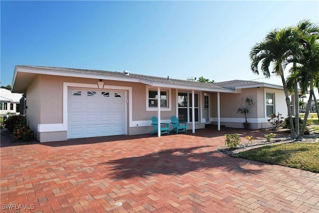 ranch-style home with a garage