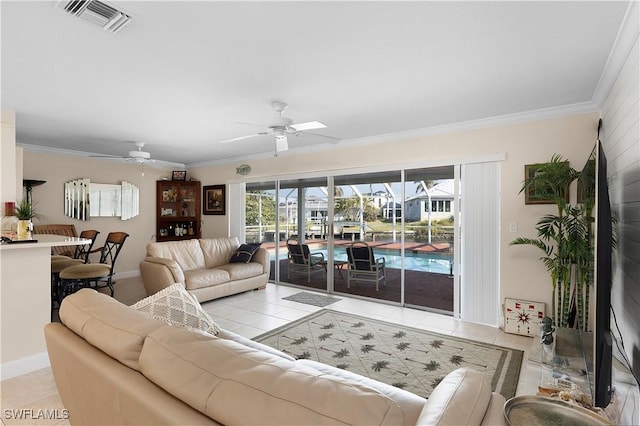 tiled living room with ceiling fan and ornamental molding