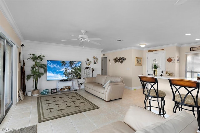 tiled living room with crown molding and ceiling fan