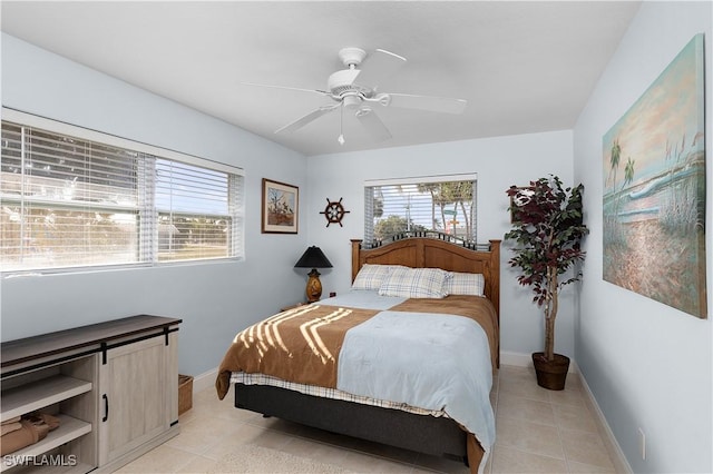 tiled bedroom with ceiling fan