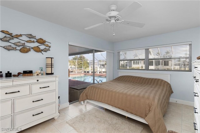 tiled bedroom with access to outside and ceiling fan