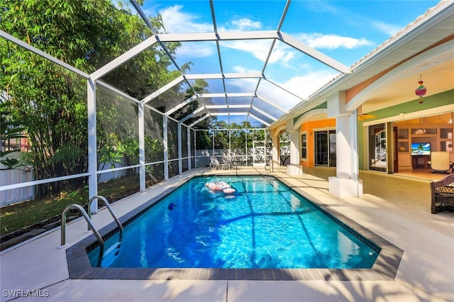 view of pool featuring ceiling fan, a patio area, fence, and a fenced in pool