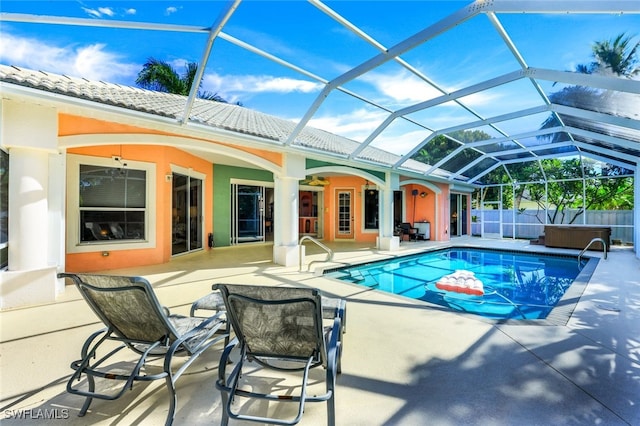 view of pool featuring a patio, a lanai, a jacuzzi, fence, and a fenced in pool