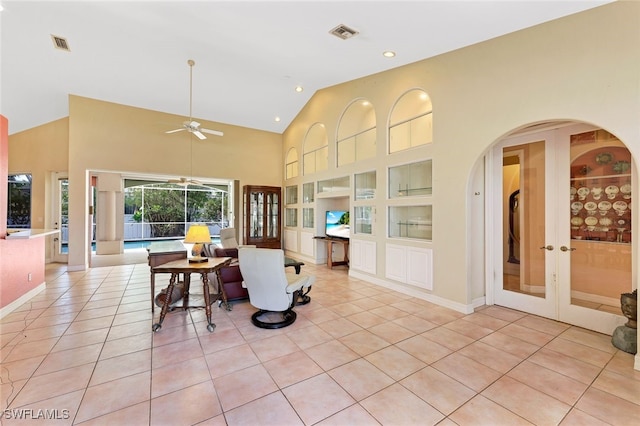 interior space with built in shelves, french doors, visible vents, and light tile patterned floors