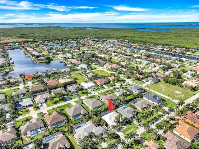 bird's eye view with a residential view and a water view