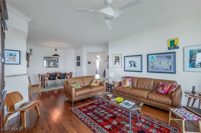 living room with hardwood / wood-style floors, ceiling fan, and ornamental molding