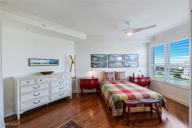 bedroom featuring ceiling fan, dark hardwood / wood-style floors, and crown molding