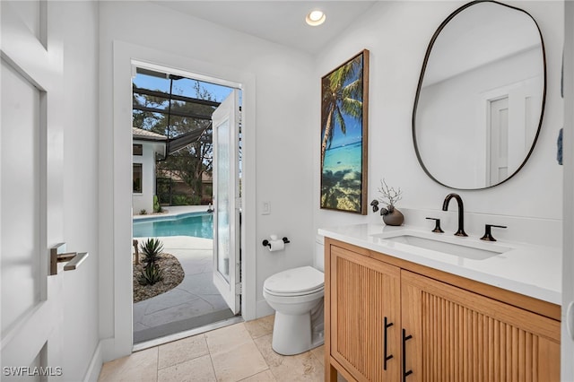 bathroom featuring toilet and vanity