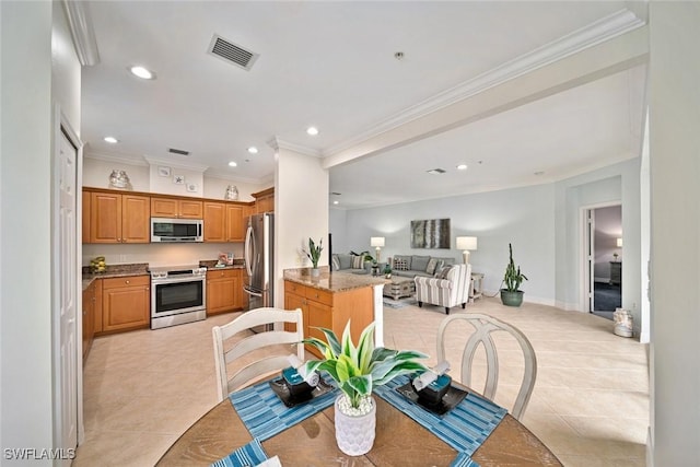 tiled dining room with crown molding