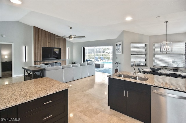 kitchen featuring ceiling fan with notable chandelier, dishwasher, lofted ceiling, decorative light fixtures, and sink