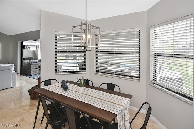 dining area featuring an inviting chandelier