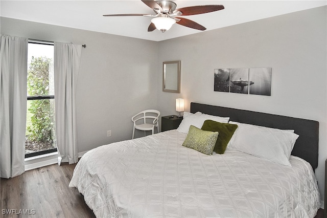 bedroom featuring ceiling fan and hardwood / wood-style floors