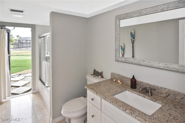 full bathroom featuring toilet, tile patterned floors, enclosed tub / shower combo, and vanity