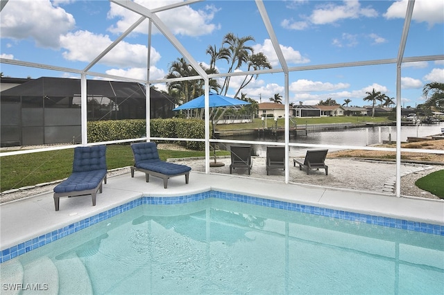 view of pool featuring a water view, a patio, and a lanai