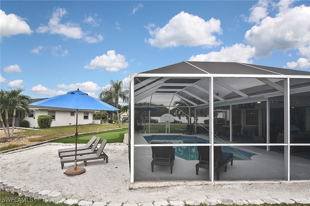 view of property's community with a swimming pool and a patio