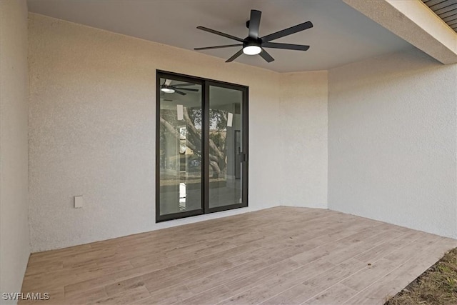 view of patio / terrace featuring ceiling fan and a wooden deck