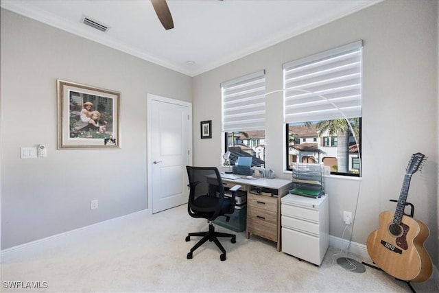 home office with crown molding and light colored carpet