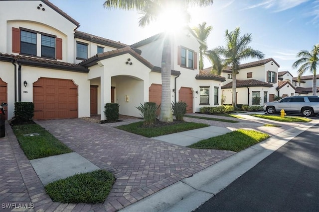 mediterranean / spanish-style house featuring a garage