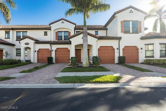 mediterranean / spanish-style house featuring a garage