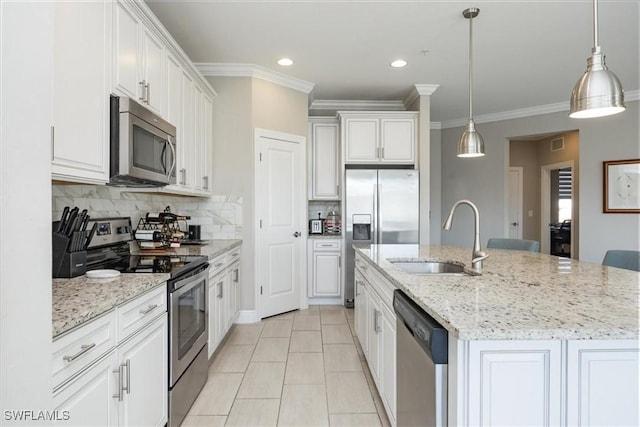 kitchen featuring stainless steel appliances, an island with sink, and white cabinets