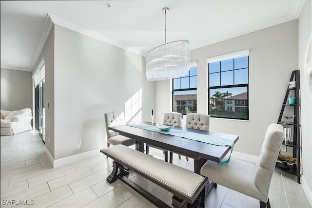 dining room featuring crown molding and a chandelier