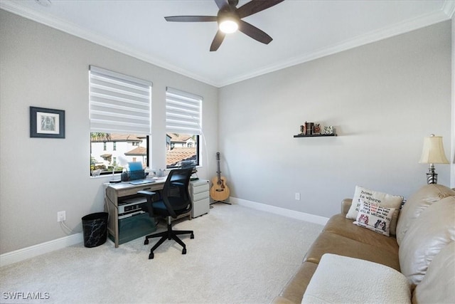 carpeted home office with ornamental molding and ceiling fan