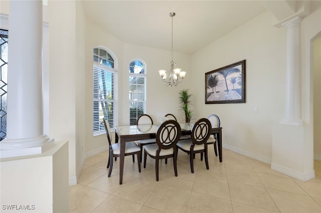 tiled dining area with decorative columns and a chandelier