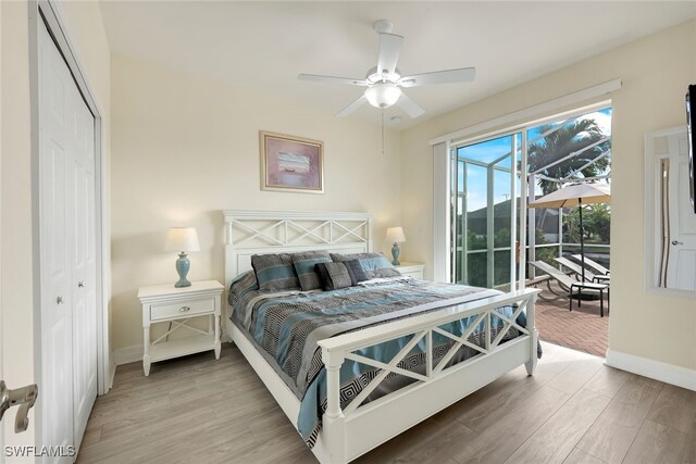 bedroom with hardwood / wood-style flooring, access to exterior, ceiling fan, and a closet