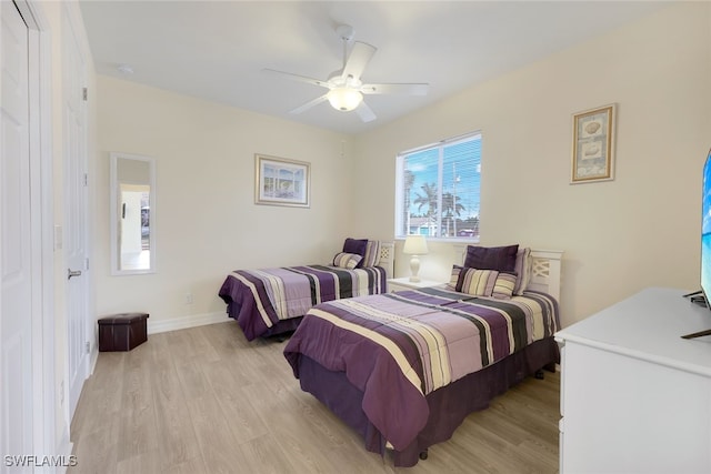 bedroom featuring light hardwood / wood-style floors and ceiling fan