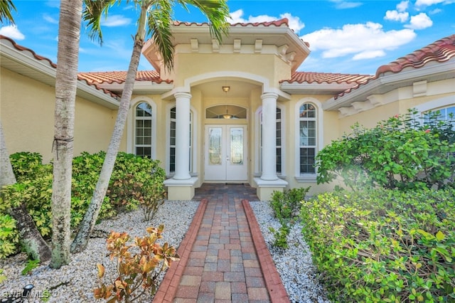 entrance to property featuring french doors