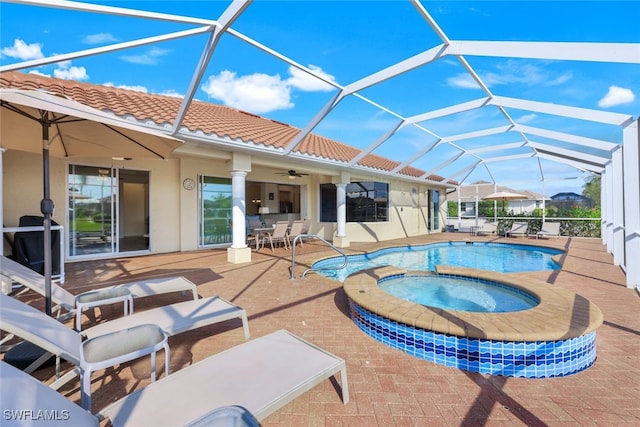 view of swimming pool with an in ground hot tub, a lanai, and a patio area