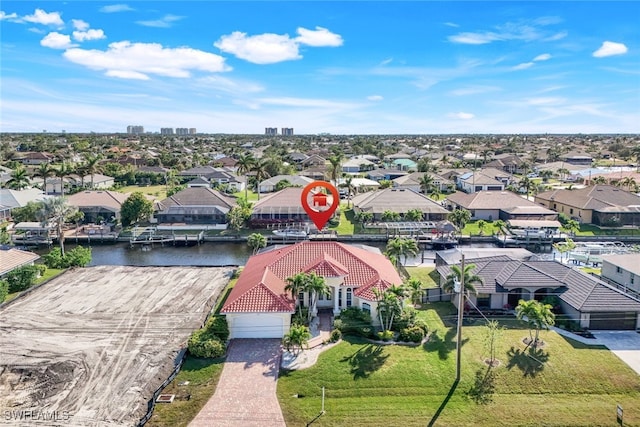 birds eye view of property with a water view