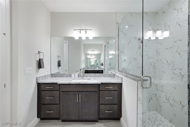 bathroom with vanity and walk in shower