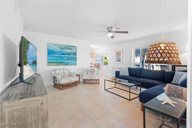 living room featuring tile patterned floors and ceiling fan