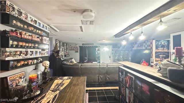 bar with ceiling fan and dark tile patterned floors