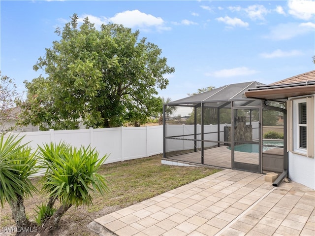 view of patio with a lanai and a fenced in pool