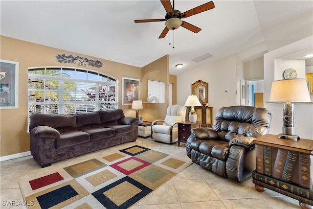 tiled living room featuring ceiling fan and lofted ceiling