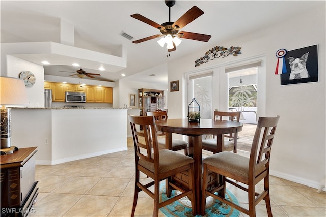 dining space featuring vaulted ceiling, ceiling fan, light tile patterned floors, and french doors