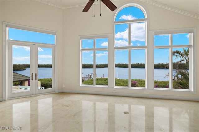 interior space featuring ceiling fan, a high ceiling, french doors, and a water view