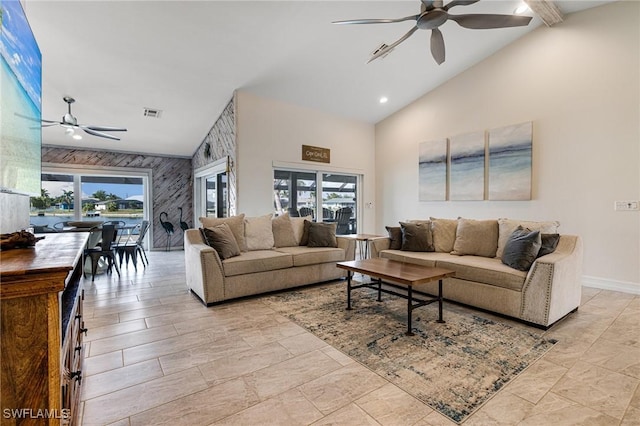 living room with high vaulted ceiling and ceiling fan