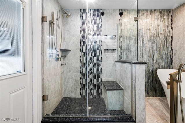 bathroom with tile walls and plus walk in shower