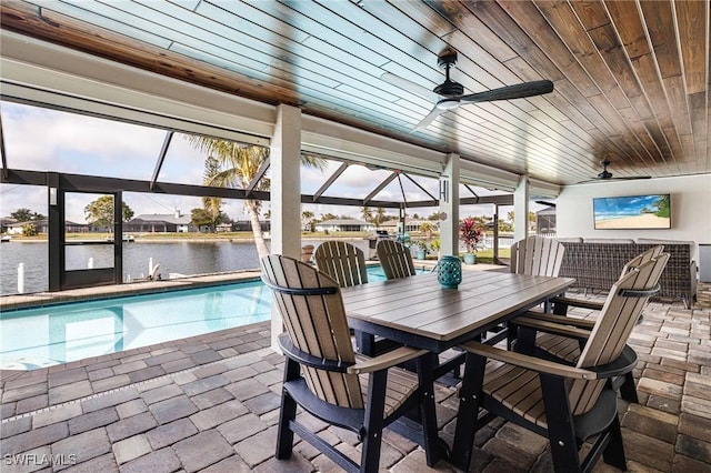 exterior space with ceiling fan and a lanai