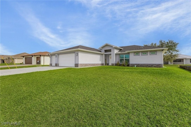 ranch-style home featuring a garage and a front lawn