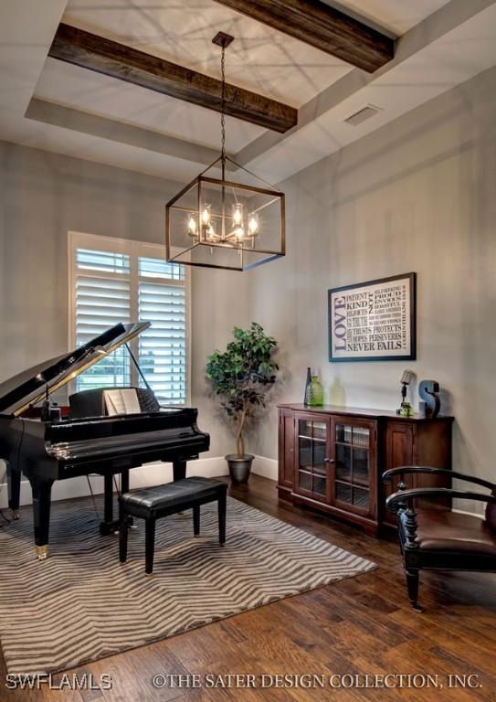 misc room featuring wood-type flooring, an inviting chandelier, and beam ceiling