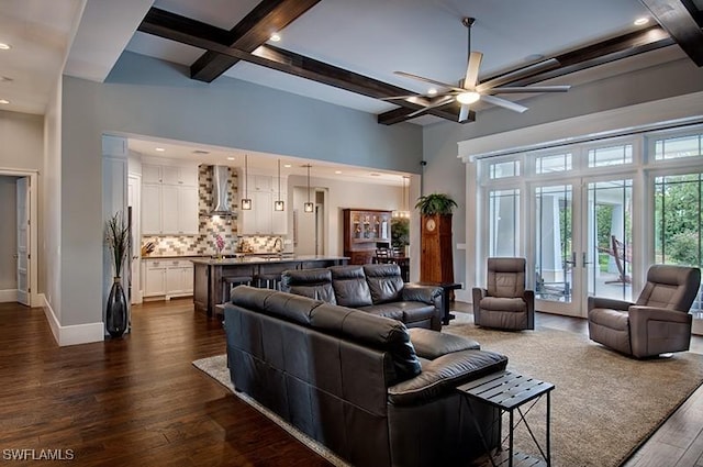 living room featuring beam ceiling, french doors, dark wood finished floors, a ceiling fan, and baseboards