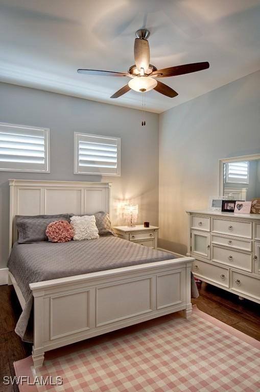 bedroom featuring light wood-style flooring and a ceiling fan