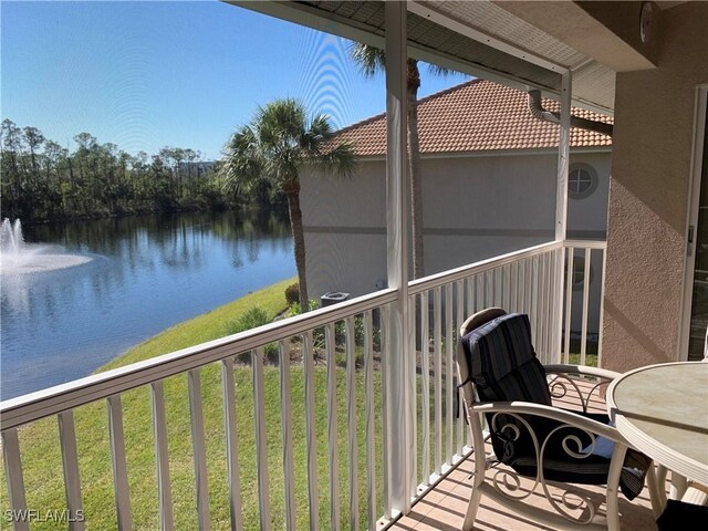 balcony featuring a water view