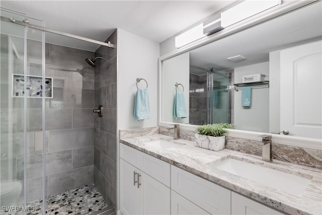 bathroom with vanity and walk in shower