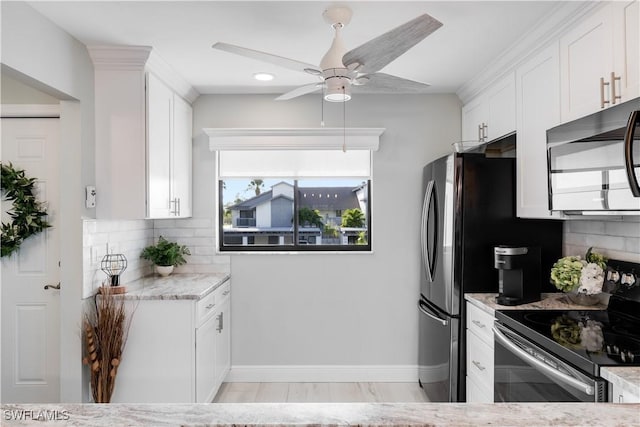 kitchen featuring decorative backsplash, light stone countertops, stainless steel electric stove, ceiling fan, and white cabinets